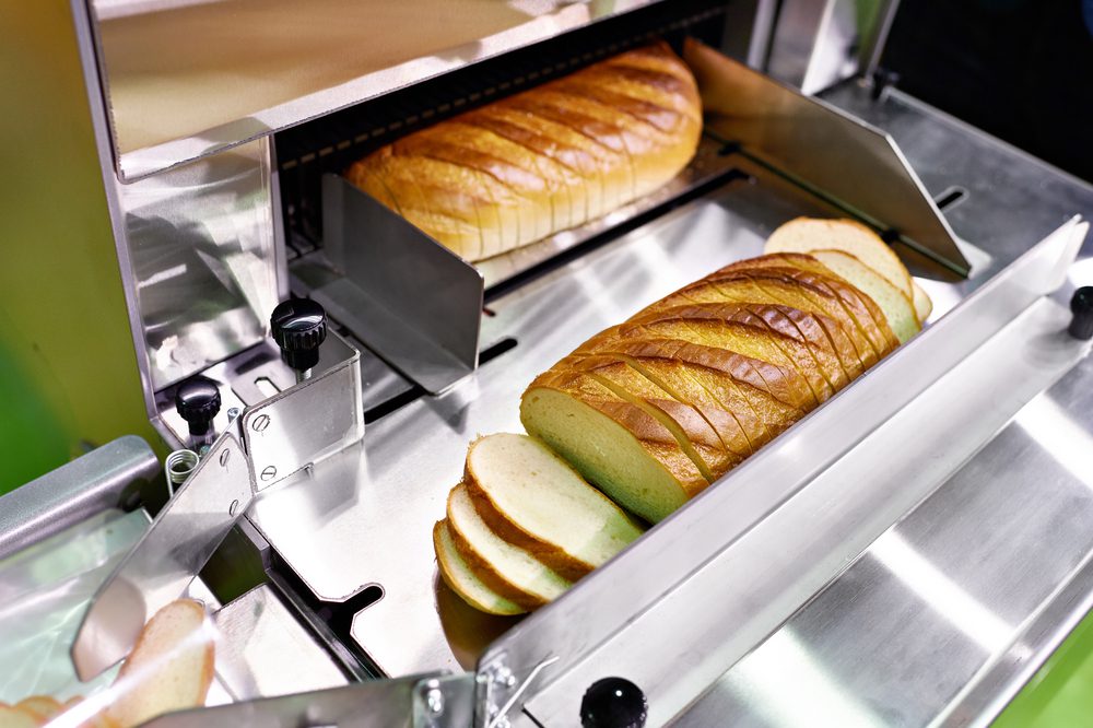 Big,Bread,Cutting,Machine,Closeup